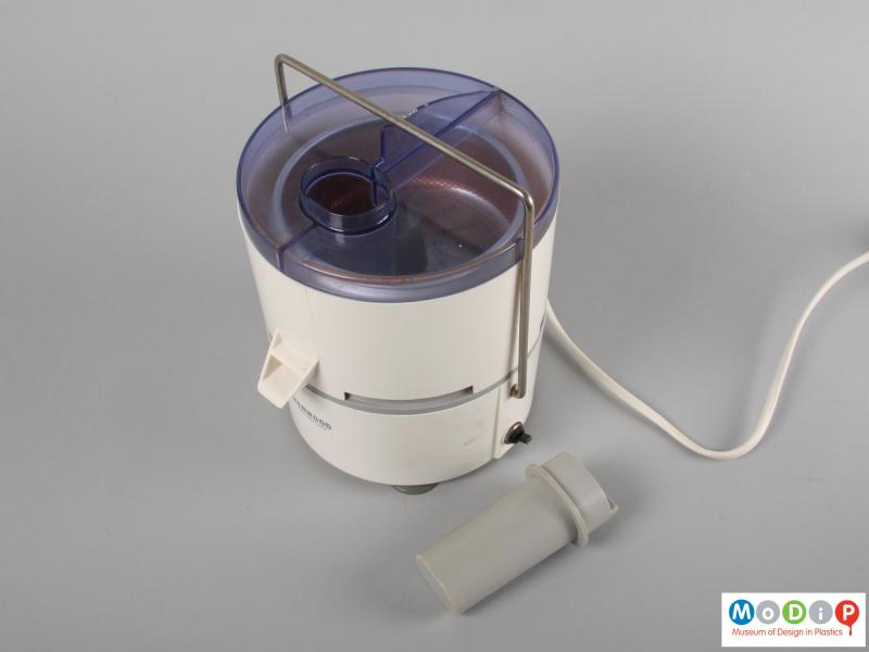 Top view of a juicer showing the feeder tube.
