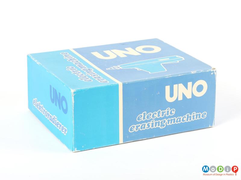 Side view of an Uno erasing machine showing the lid of the box.