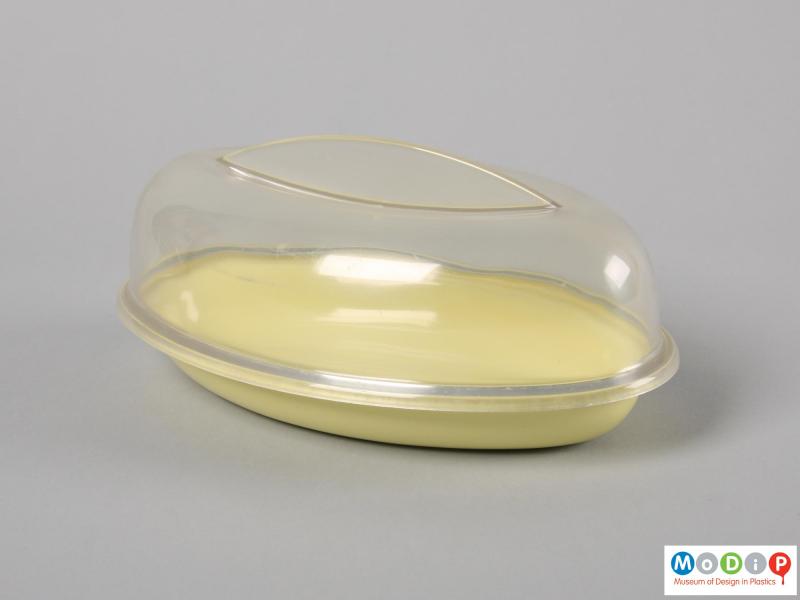 Side view of a butter dish showing the elongated shape.