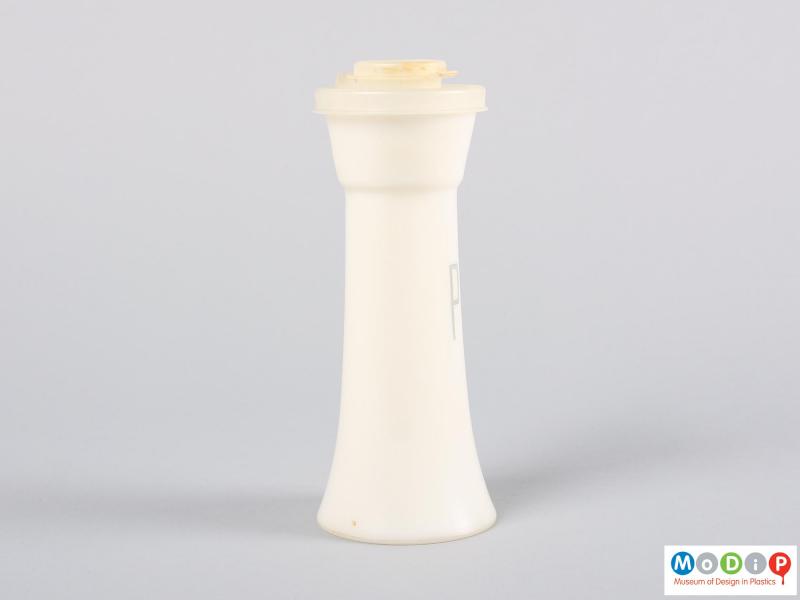 Side view of a pepper shaker showing the fluted shape.