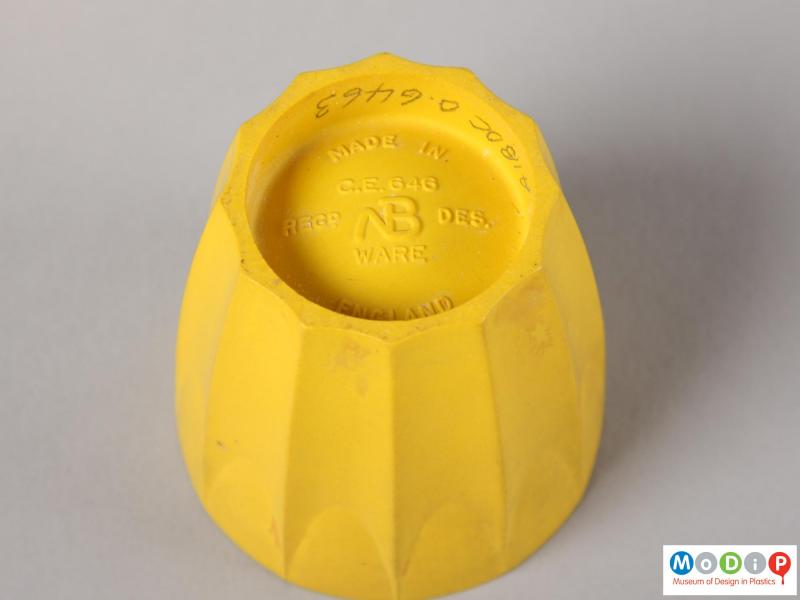 Underside view of an nBware egg cup showing the moulded inscription in the base.