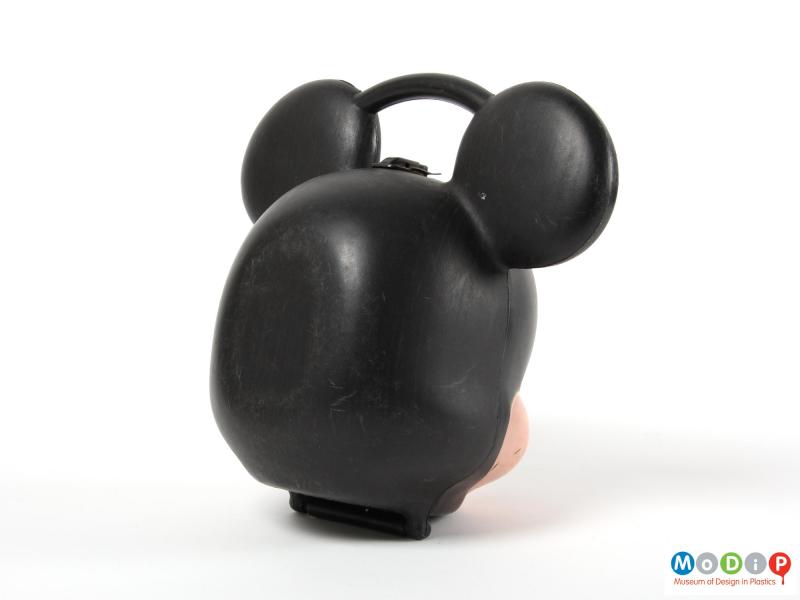 Rear view of a Mickey Mouse lunch box showing the flat back so that it can sit flat on a surface.