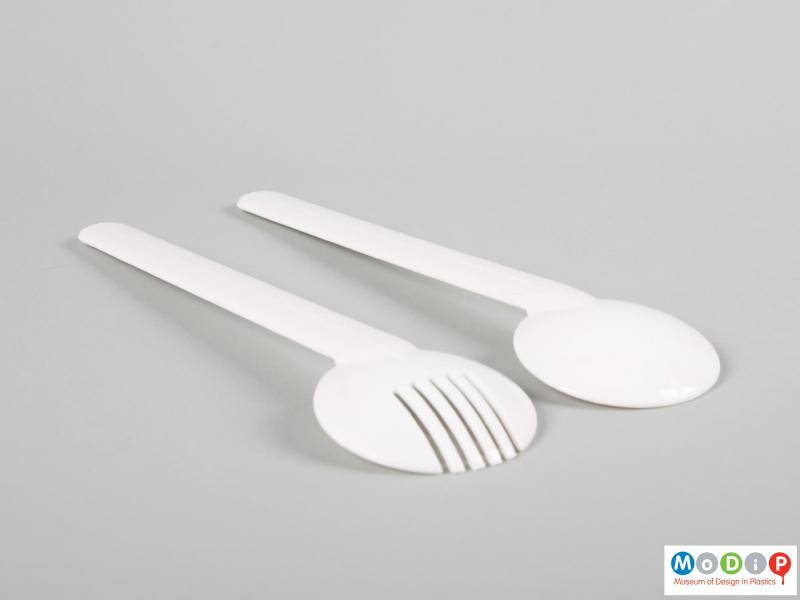 Side view of a set of salad servers showing the depth of the bowls.