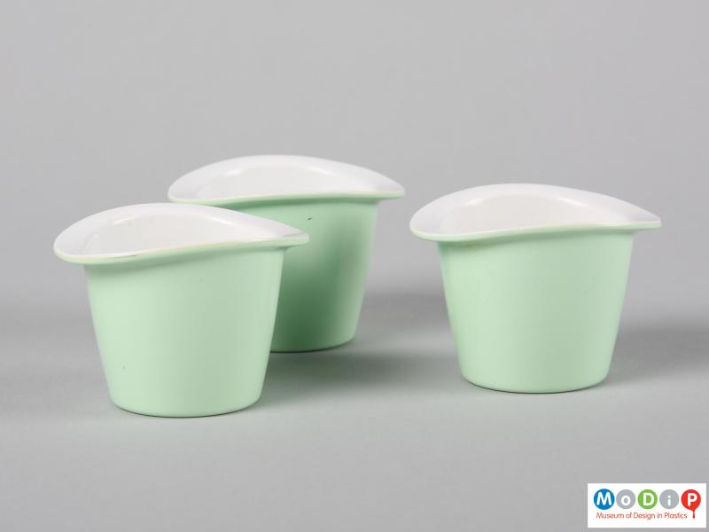 Side view of three Ranton egg cups showing the plain sides of the cups.