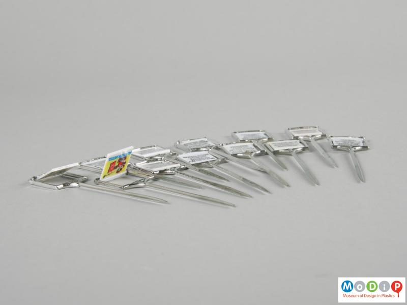 Side view of a set of cocktail sticks showing the swinging motion.