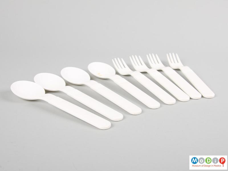 Side view of a cutlery set showing the large, straight handles.