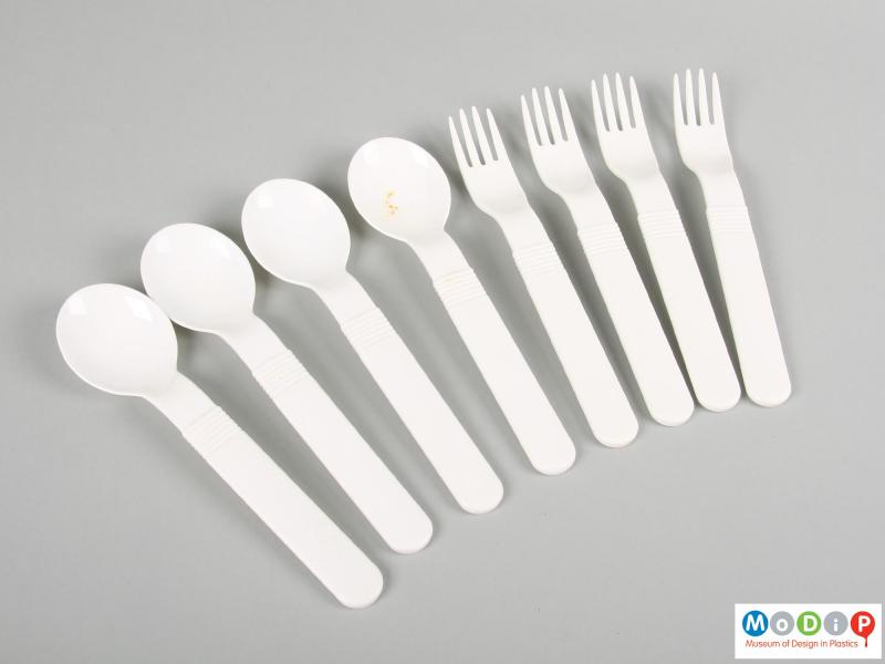 Top view of a cutlery set showing the ridged pattern on the handles.