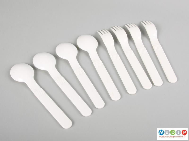Underside view of a cutlery set showing the ridged pattern on the handles.