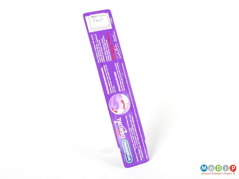 Rear view of a Wisdon toothbrush showing the printed back of the packet.
