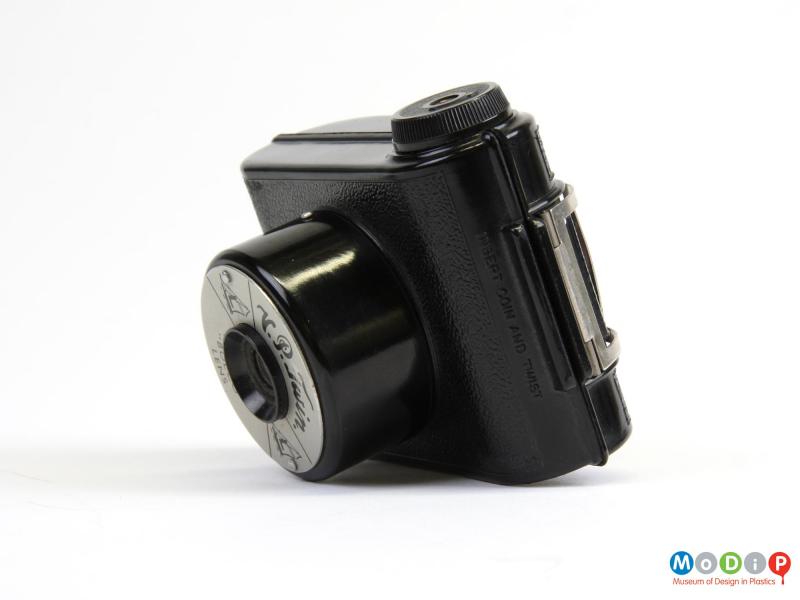 Side view of a camera showing the closed metal view finder.