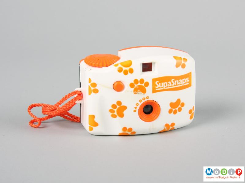 Front view of a camera showing paw print decoration.