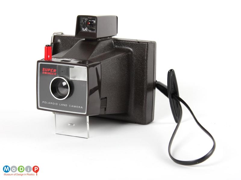 Side view of a Polaroid camera showing the carrying loop.