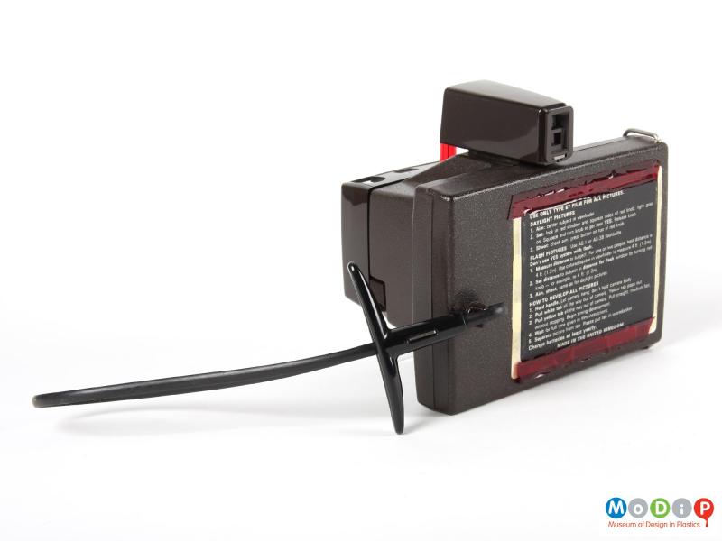 Rear view of a Polaroid camera showing the square back panel.