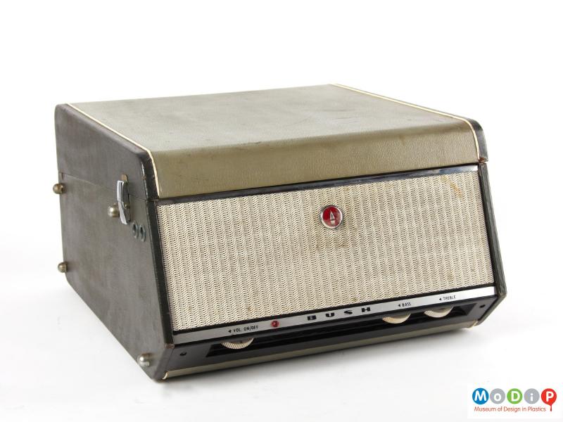 Front view of a Bush Monarch record player showing the lid closed.  The speaker and control dials are visible.