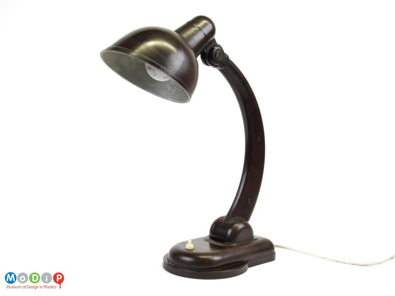 Side view of a desk lamp showing the curved arm.