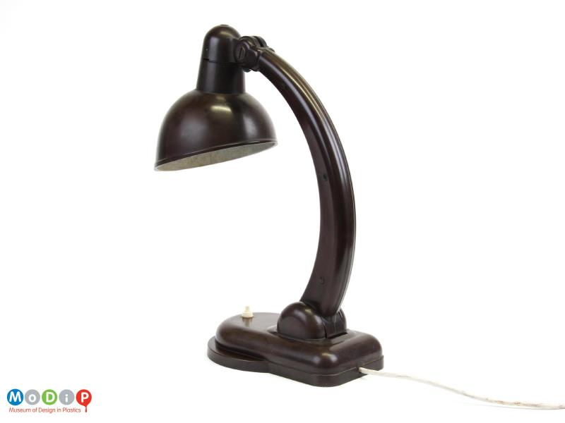 Rear view of a desk lamp showing the curved arm.