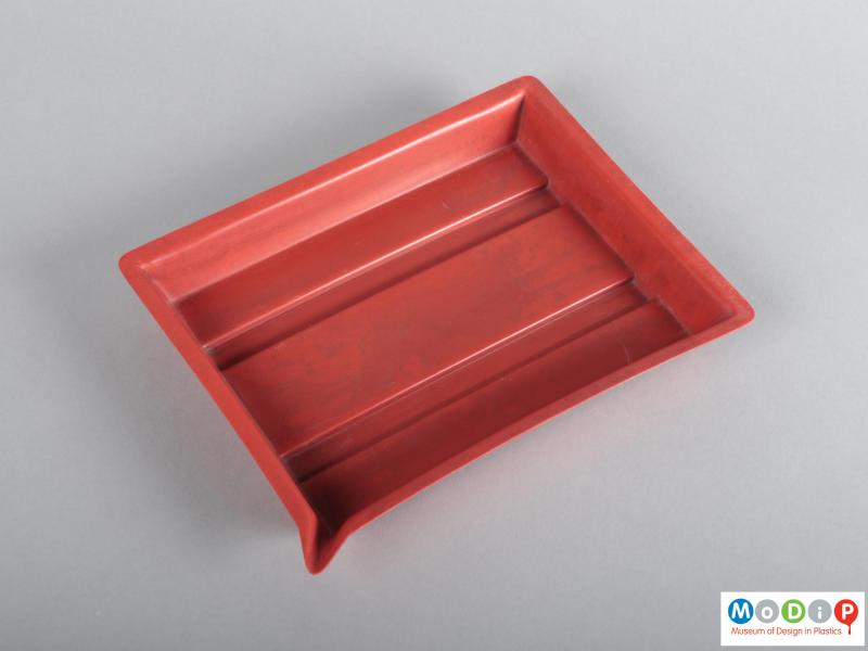 Top view of a developing tray showing the pouring spout in the corner.