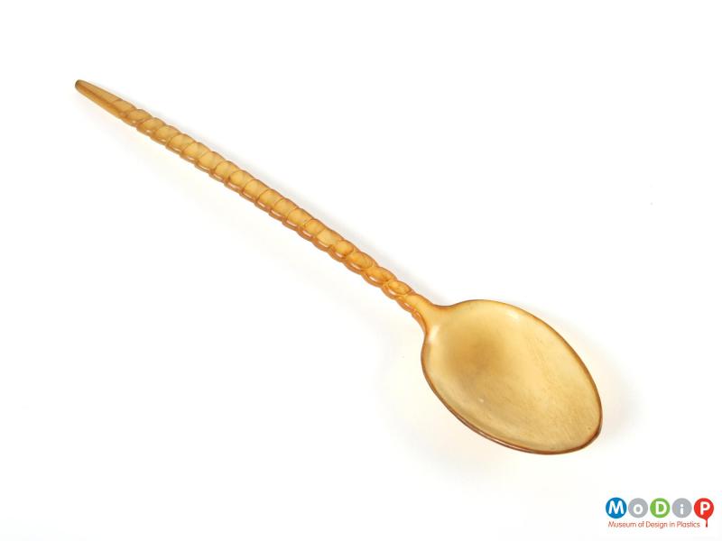 Top view of a spoon showing the bowl and handle.