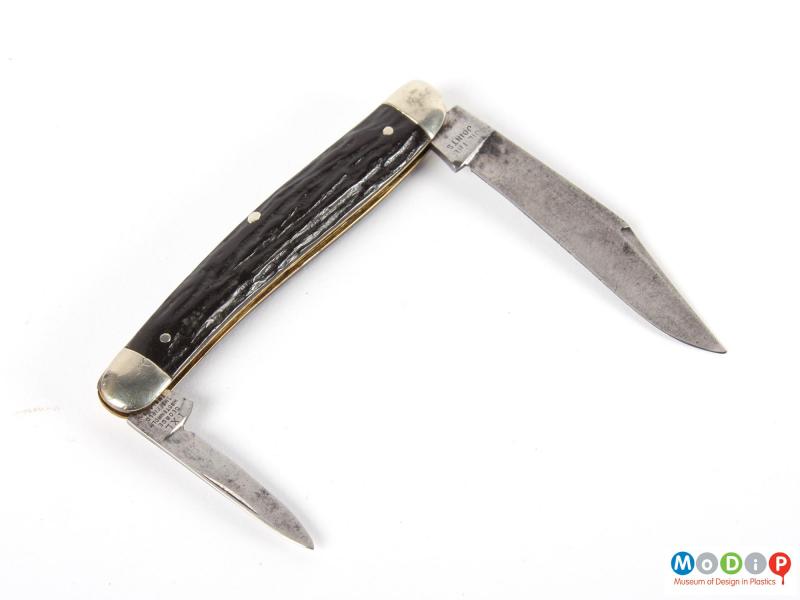Side view of a penknife showing the open blades.
