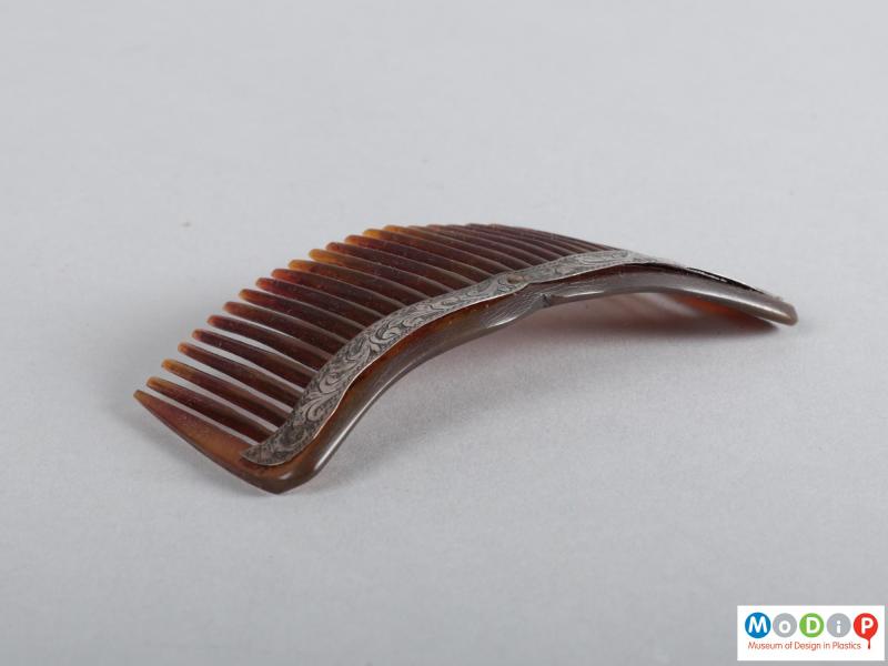 Side view of a comb showing the heading.