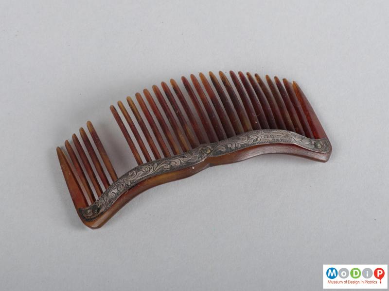 Top view of a comb showing the heading and teeth.