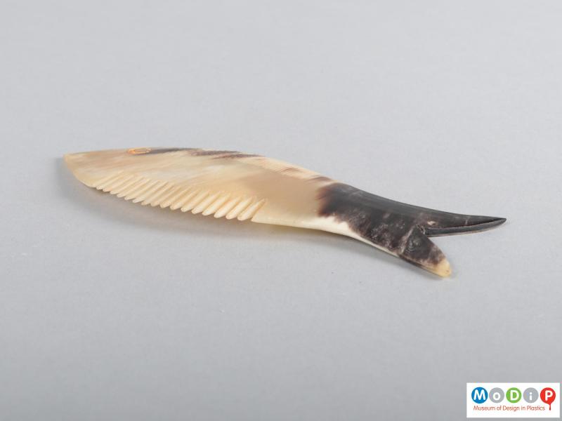 Side view of a comb showing the tail.