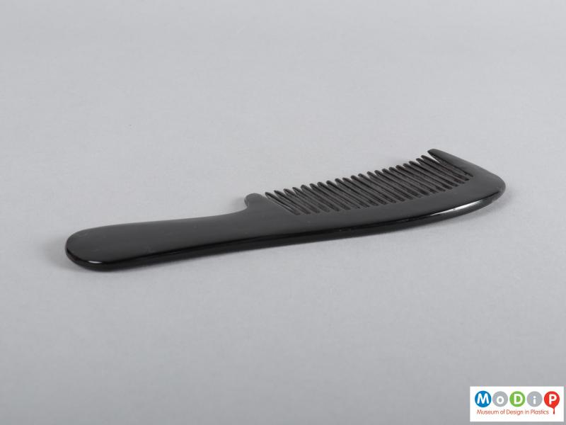 Side view of a comb showing the handle.