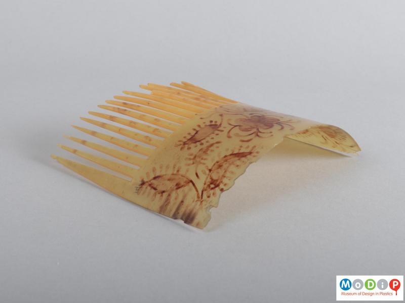 Side view of a comb showing the heading.