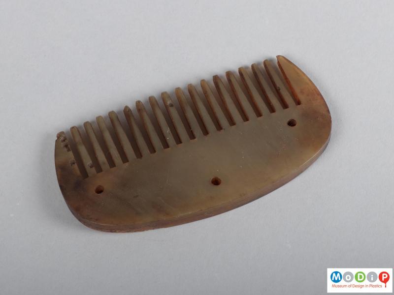 Top view of a comb showing the heading and teeth.