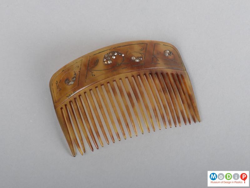 Top view of a comb showing the heading and teeth.