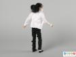 Rear view of a Michael Jackson doll showing the bandaged hand.
