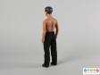 Rear view of a Peter Andre doll showing the figure standing.