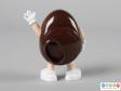 Rear view of a brown M&M figure showing the back plate with lipped hole on one side.