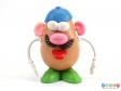 Front view of a potato figure showing the component parts including hat and moustache.