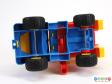 Underside view of a toy truck showing the metal axles.