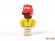 Side view of a pencil topper showing the character holding his arms on his hips.