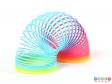 Side view of a plastic Slinky showing it expanded.