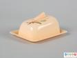 Side view of a butter dish showing the rounded shape of the cover.