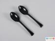 Top view of a pair of teaspoons showing the flaring handles and oval bowls,