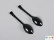 Underside view of a pair of teaspoons showing the flaring handles and oval bowls,