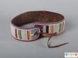 Rear view of a belt showing the leather inner surface and rear tie.