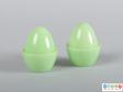 Side view of a cruet set showing the smooth egg shape.