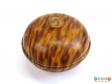 Top view of a tortoiseshell effect powder bowl showing round knob in centre of lid