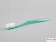 Side view of a toothbrush showing the shaped handle.