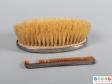 Side view of a grooming set showing the brush and comb.