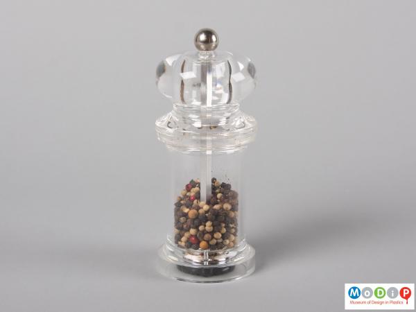 Side view of a 505 pepper grinder showing the metal knob at the top, the rotating top section and the body.