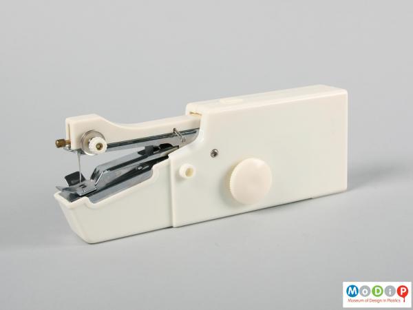 Side view of a sewing machine showing the smooth body.