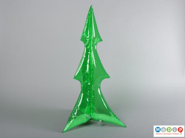 Side view of a Christmas tree showing the slender, pointed shape.