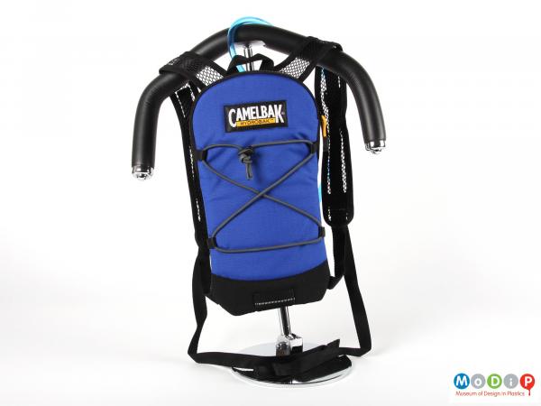 Front view of a Camelbak showing the bag hanging on a shoulder form.