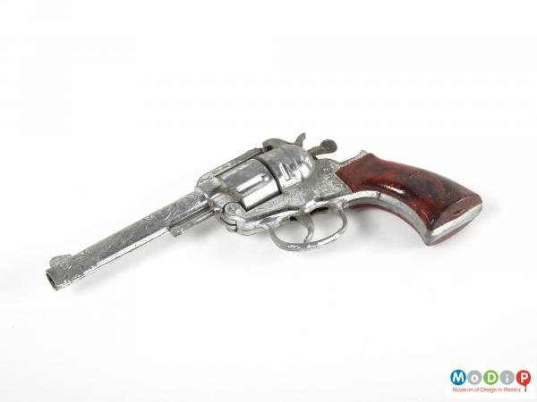Side view of a toy gun showing the trigger.